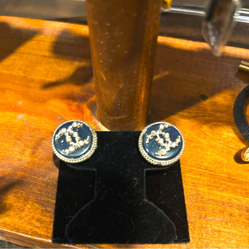 Authentic Chanel button earrings.